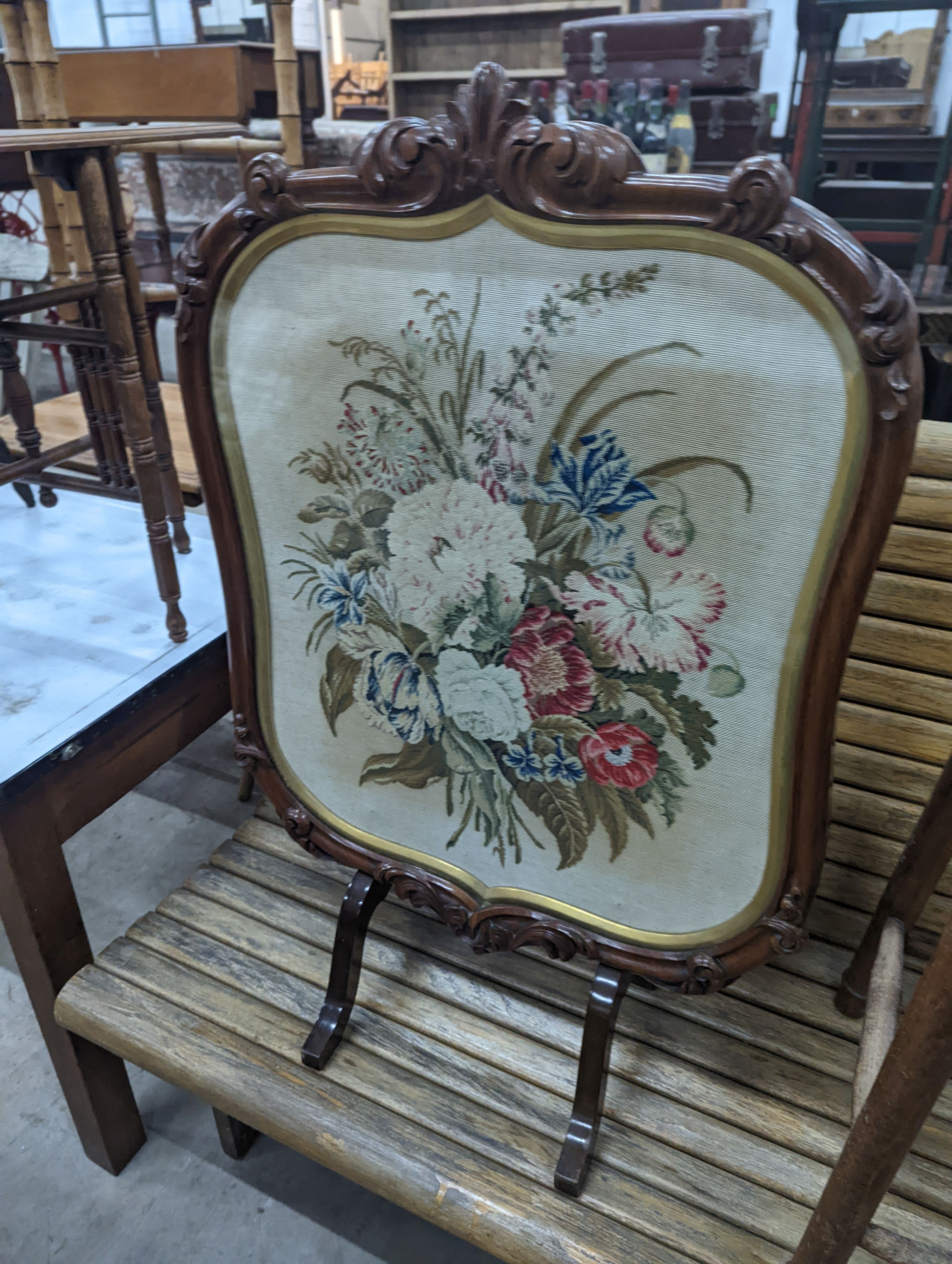 An elm and beech stool together with a Victorian rosewood tapestry firescreen